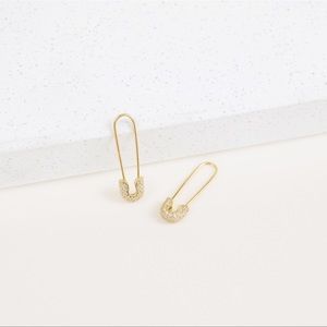 Gold safety pin rhinestone earrings.